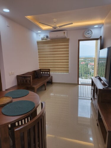 AC Hall View with 55" Smart TV, Dining table and Sofa Cum Bed