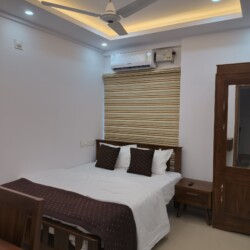 AC Bedroom - Queen Bed & Wardrobe