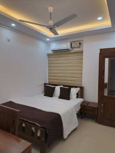 AC Bedroom - Queen Bed & Wardrobe