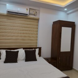 AC Bedroom - Queen Bed & Wardrobe